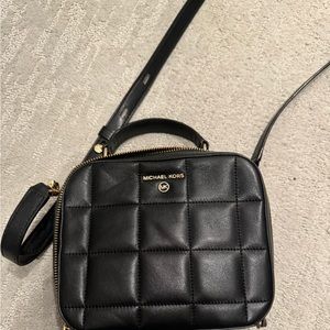 Slightly used Michael Kors purse with strap
